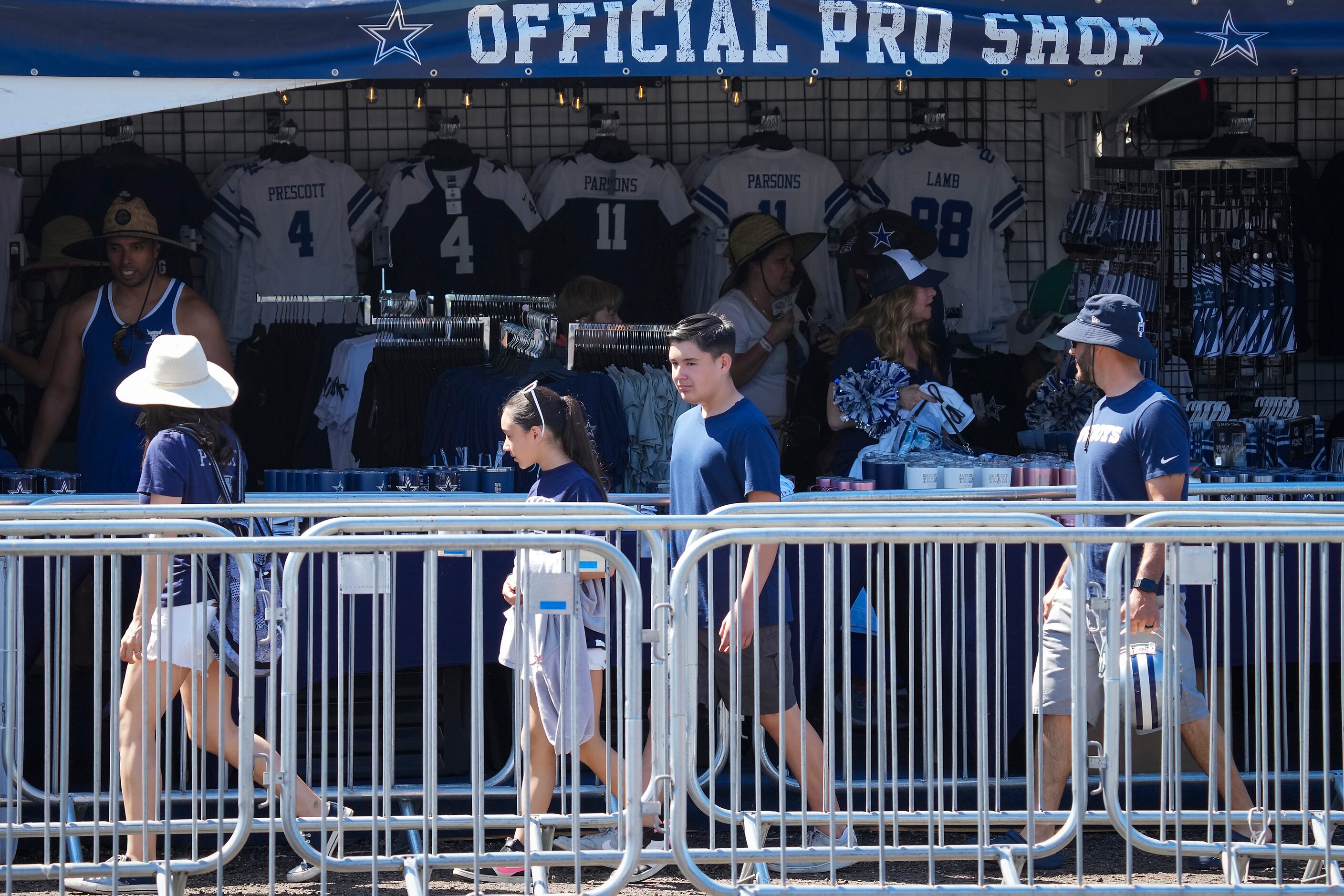 Fans head into a merchandise tent during a Dallas Cowboys training camp practice on...