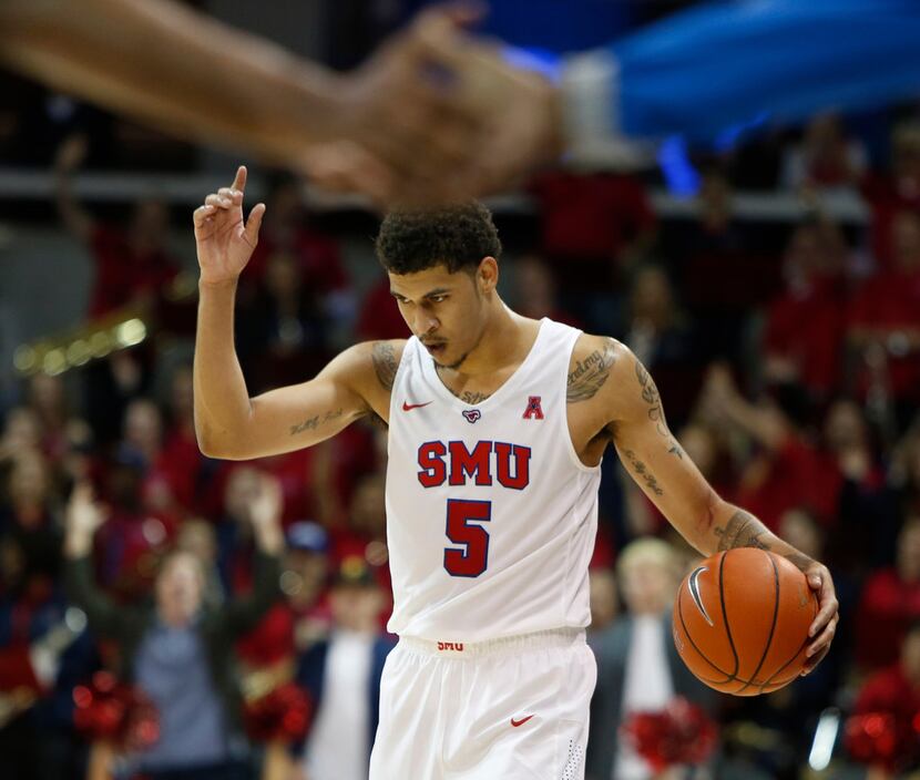 SMU guard Nat Dixon gestures as the final seconds run off the clock earning the Mustangs a...