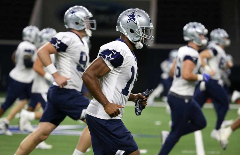 Dallas Cowboys receiver Amari Cooper (19) warms up during Dallas Cowboys practice at The...