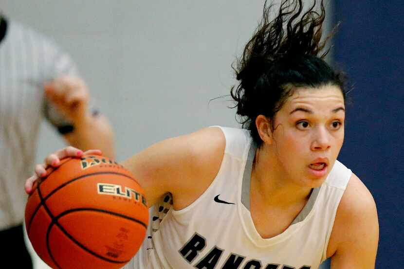 Frisco Lone Star's Mallory Adams handles the basketball late in the second half as Lone Star...
