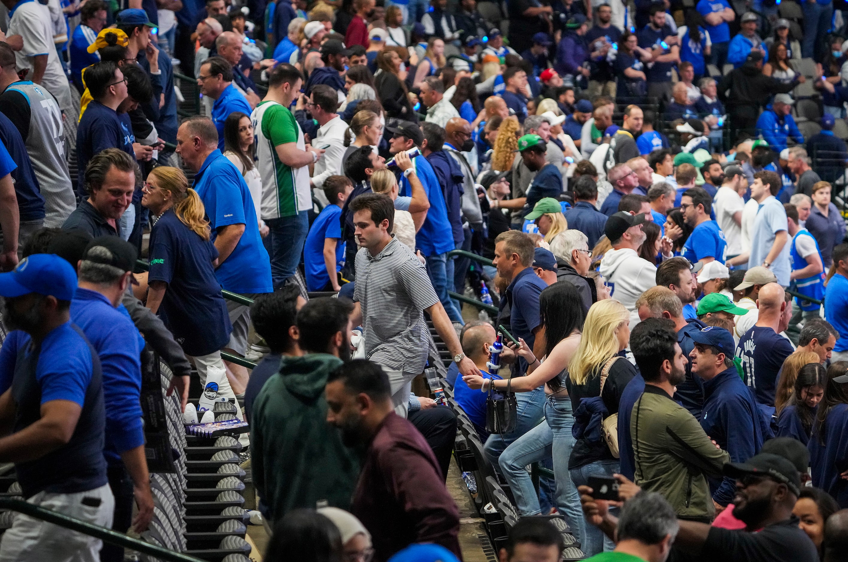 Dallas Mavericks fans head for the exits during the fourth quarter of a 109-100 loss to the...