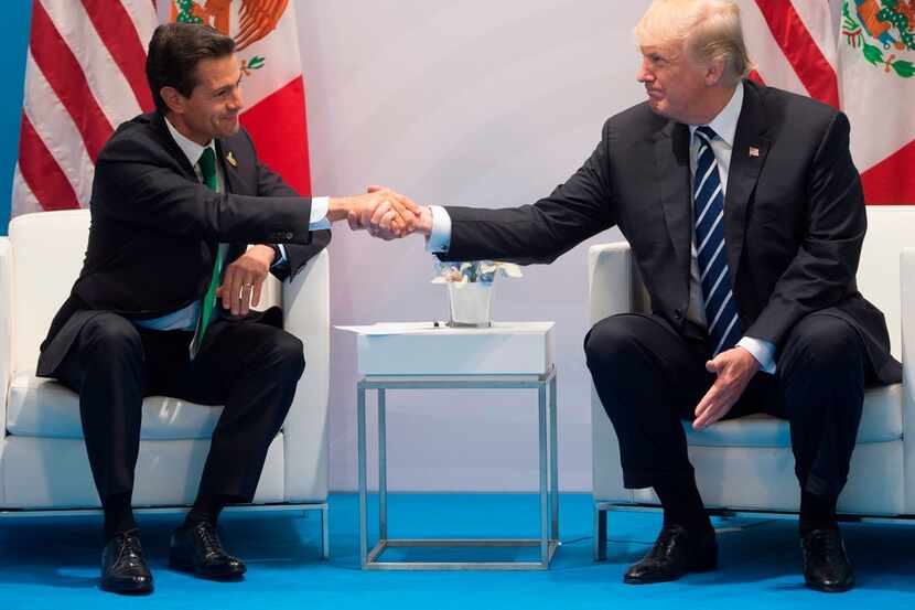 In this file photo taken on July 7, 2017 US President Donald Trump and Mexican President...