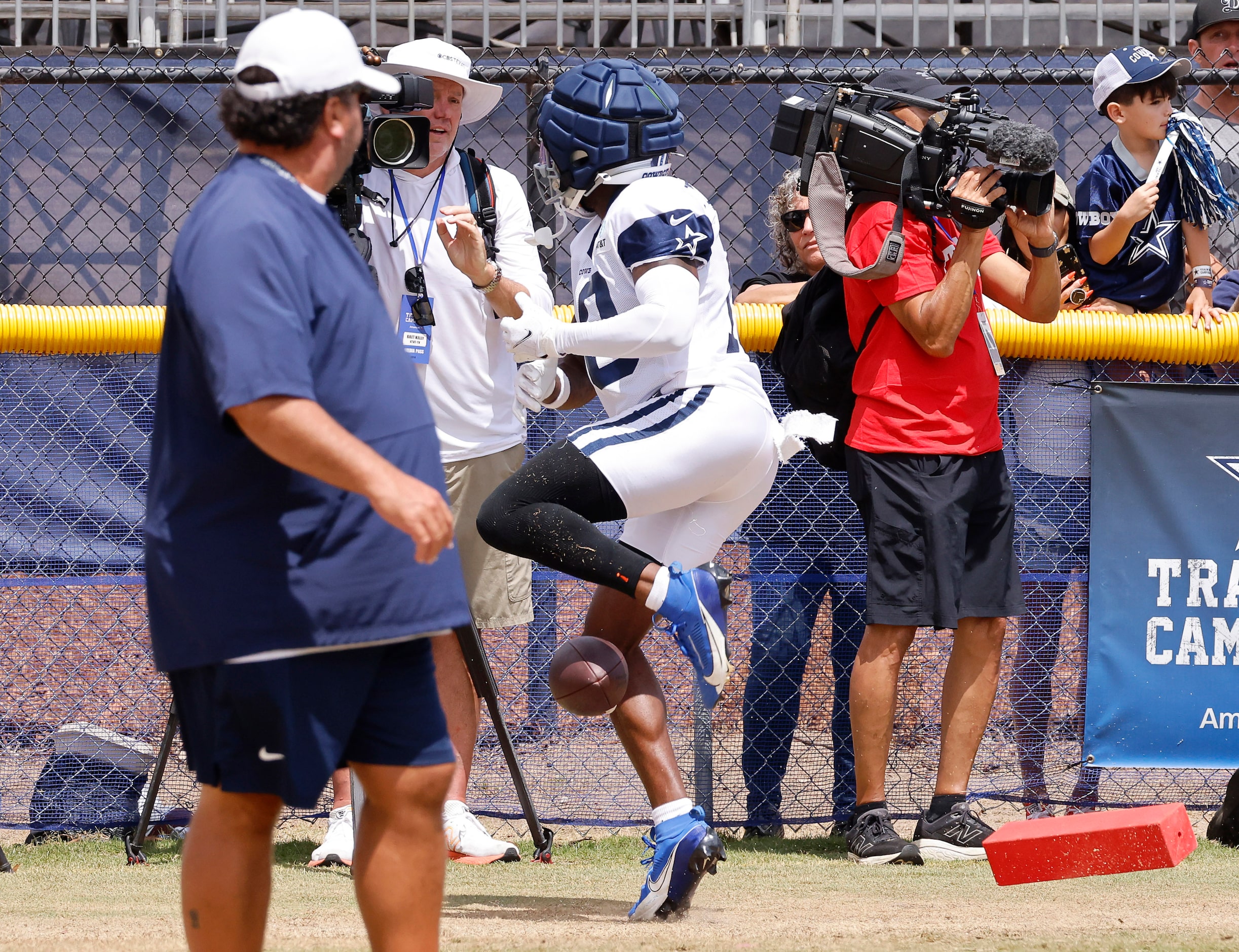 Dallas Cowboys wide receiver Ryan Flournoy (18) drops the football before go into a fence...