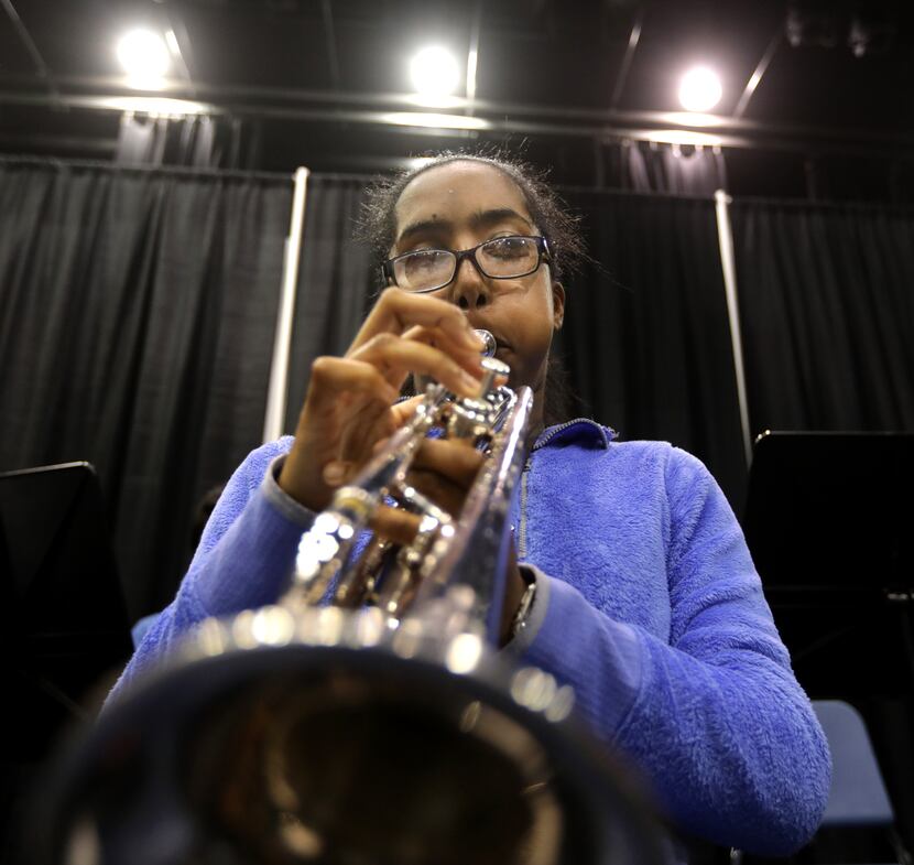 Milka Yohannes practices with the Allen High School band. Yohannes was born with congenital...
