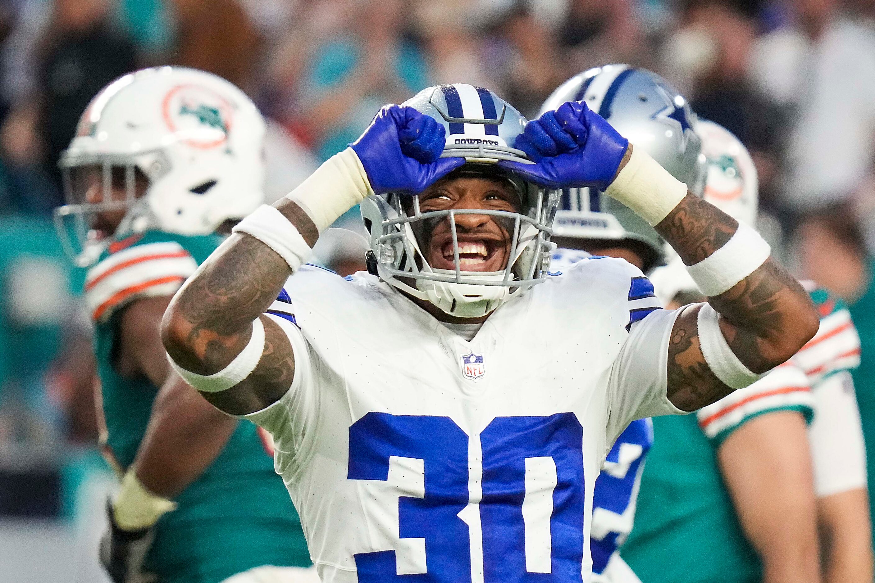 Dallas Cowboys safety Juanyeh Thomas (30) reacts after a field goal by Miami Dolphins place...