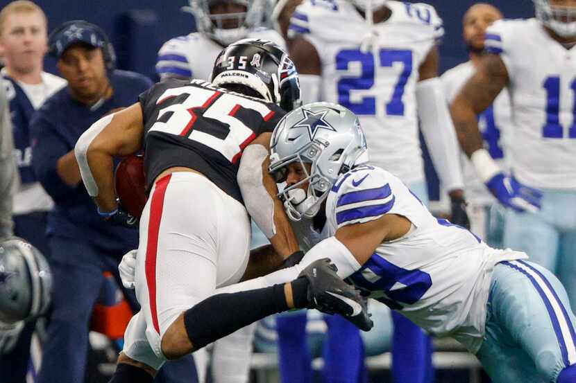 Dallas Cowboys defensive back C.J. Goodwin (29) tackles Atlanta Falcons cornerback Avery...