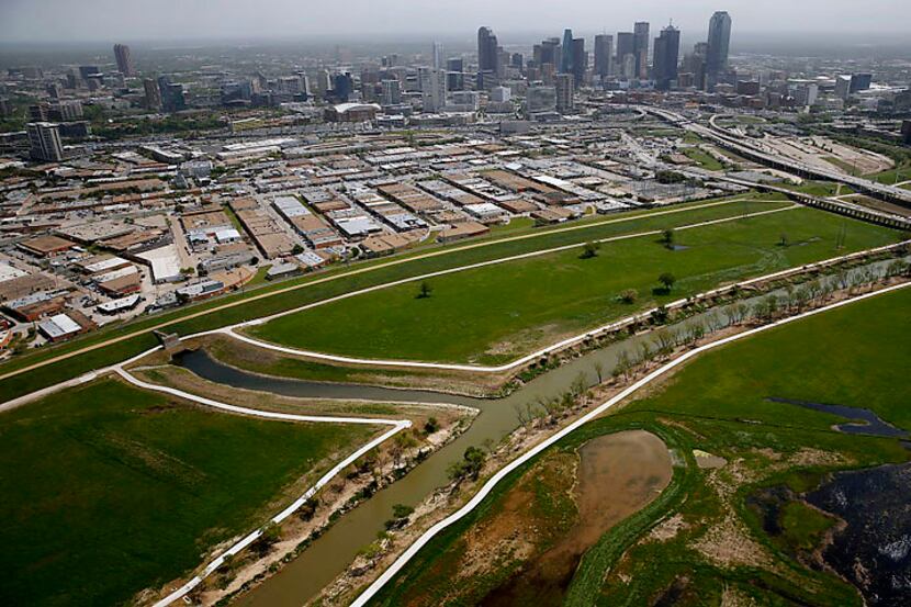A toll road between the Trinity River levees near downtown Dallas would worsen congestion on...