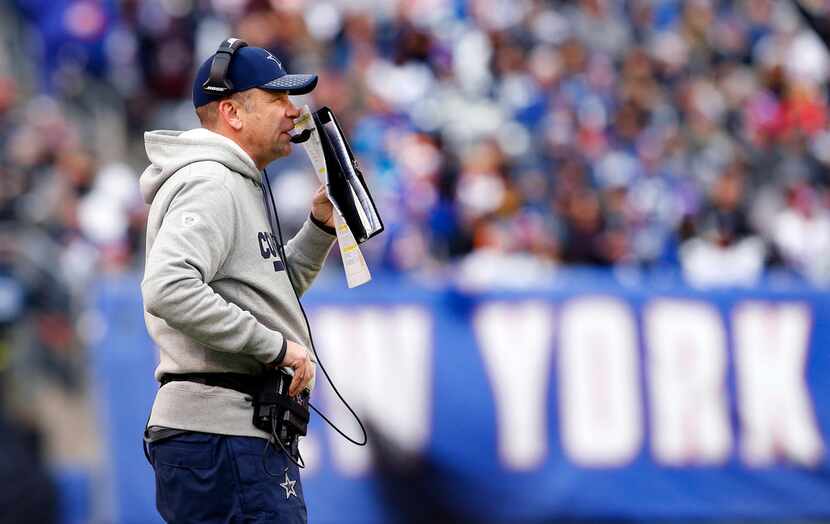 Dallas Cowboys offensive coordinator Scott Linehan calls a second quarter play against the...