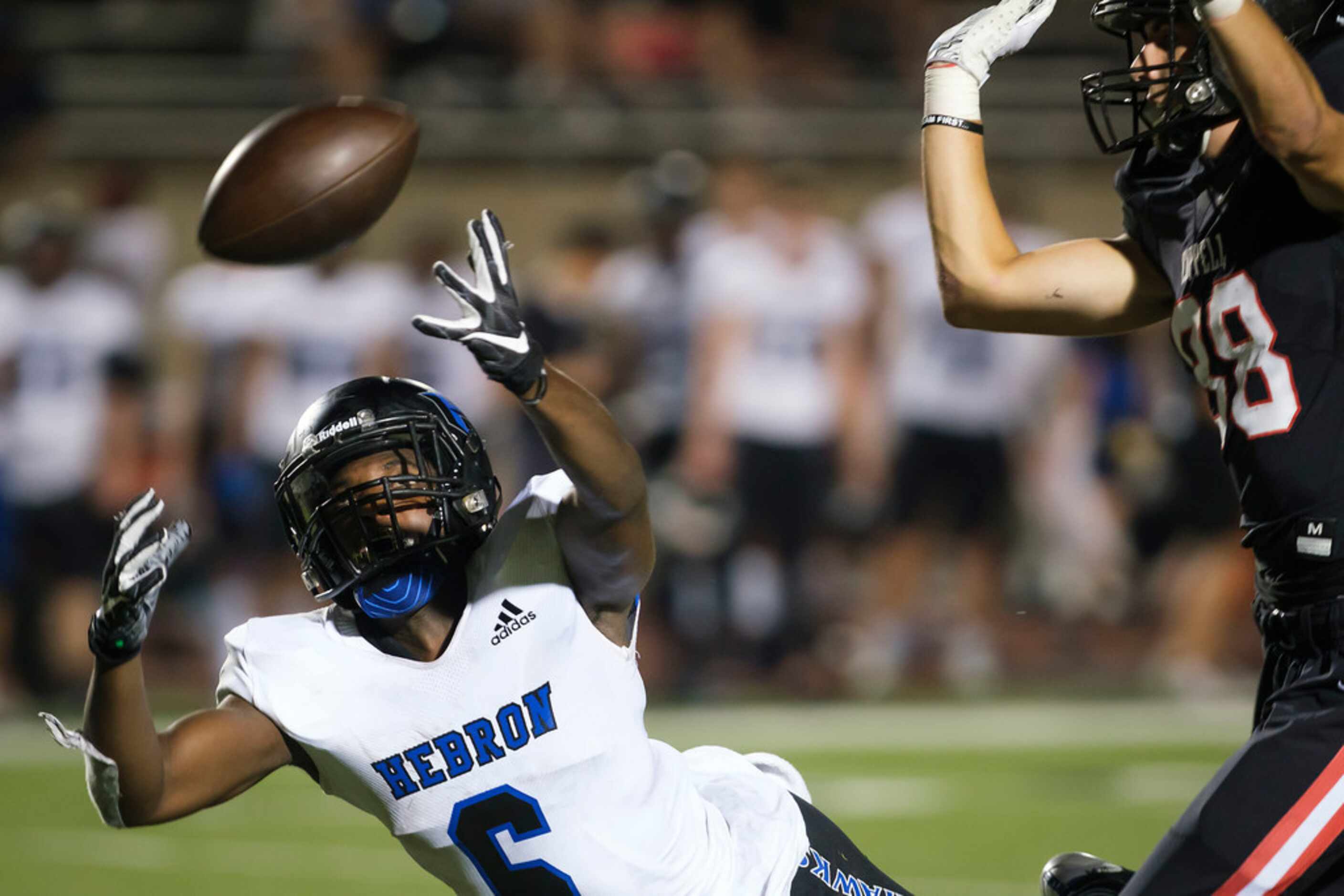 Hebron running back Jaylon Lott (6) canÃt make a catch as CoppellÃs Joey Bonfiglio (88)...