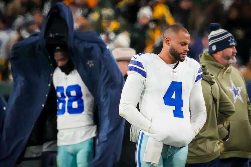 Dallas Cowboys quarterback Dak Prescott (4) and wide receiver CeeDee Lamb (88) react on the...