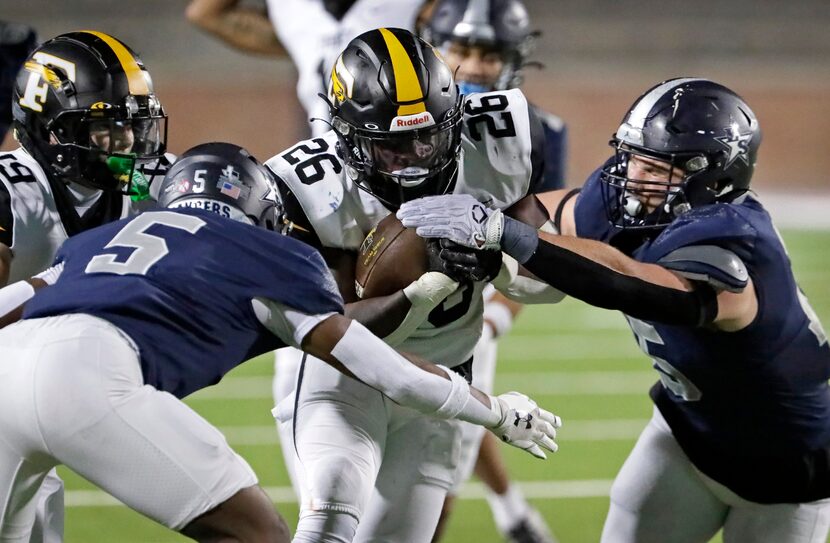 Lone Star High School cornerback Silas Davis (5) and Lone Star High School Massimo...