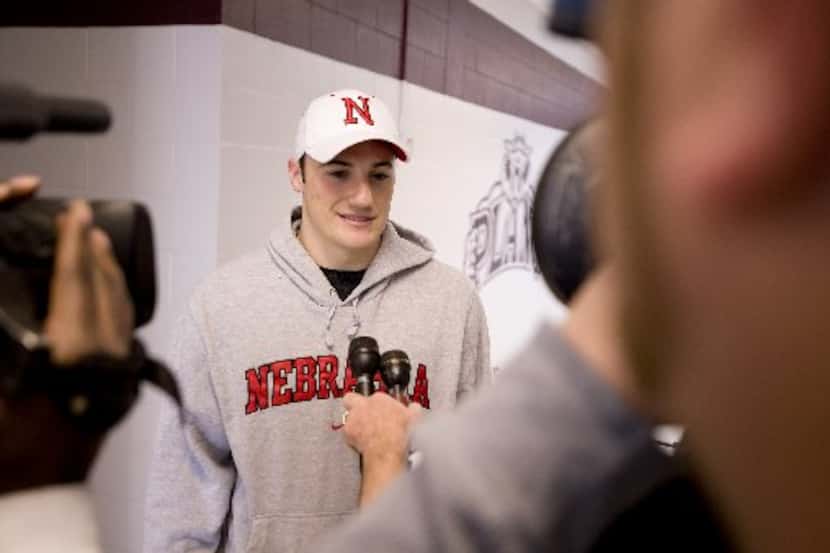 Plano Senior High School running back Rex Burkhead talks with reporters after signing a...