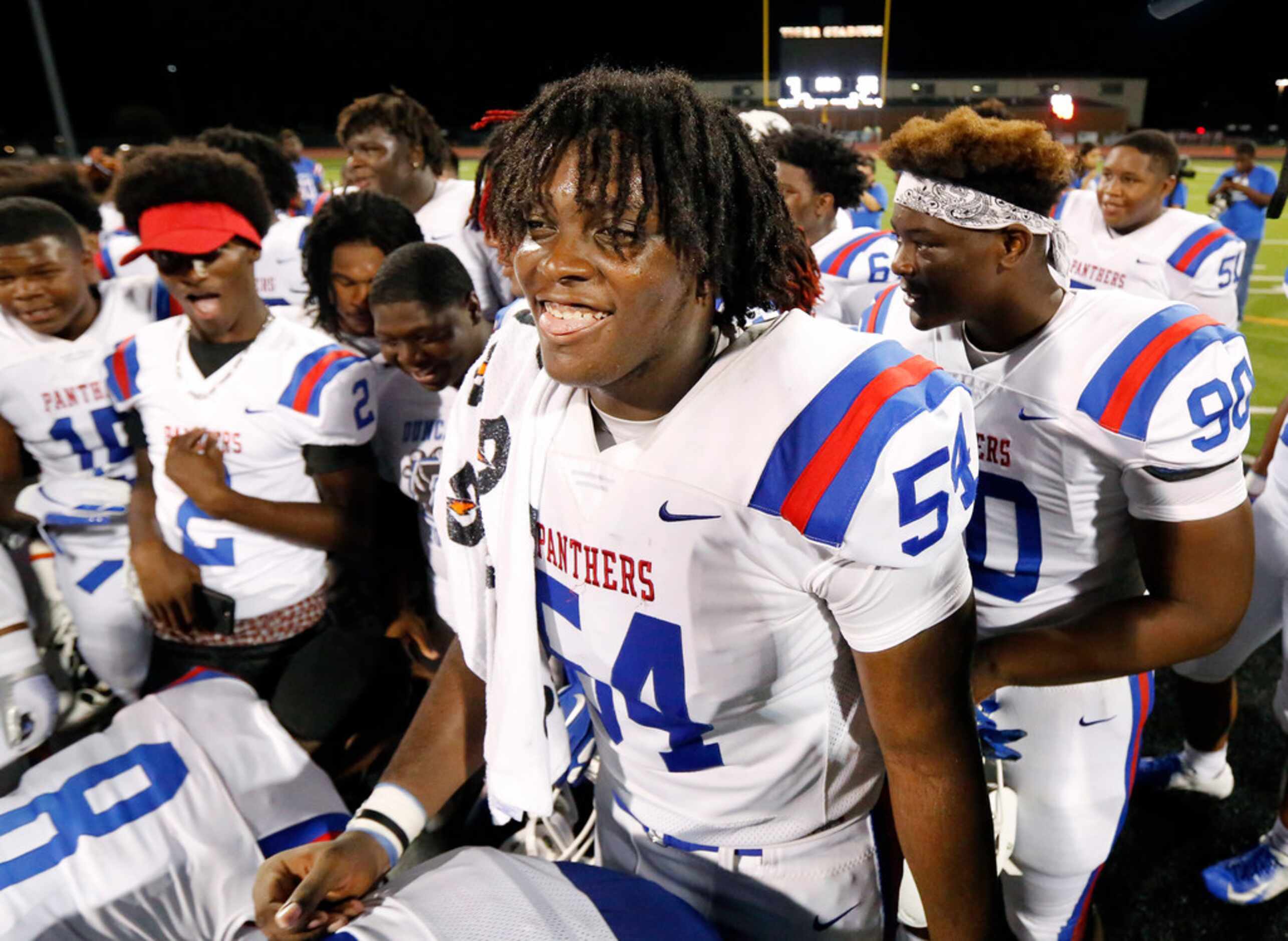 Duncanville's Savion Byrd (54) flashes a smile after he and his teammates defeated...