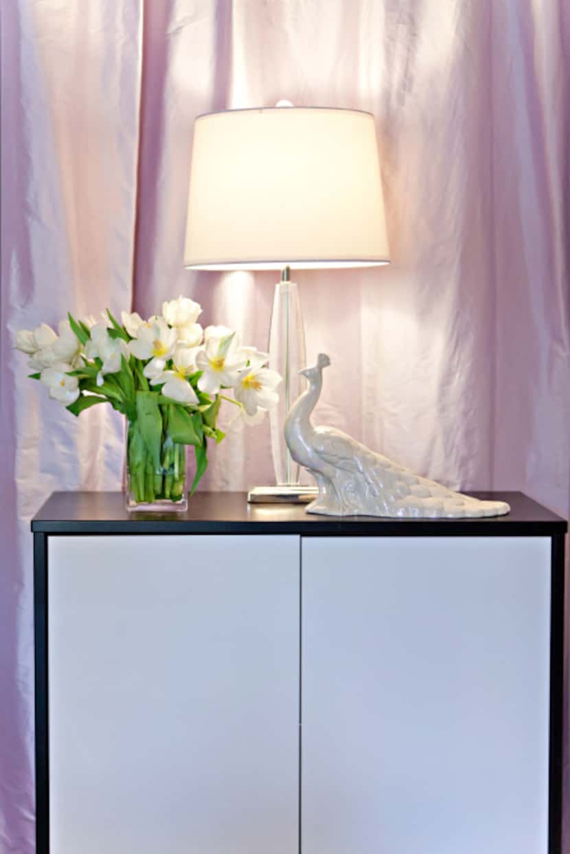 Choosing draperies in the same tone as a room's space and using simple accents helps keep a...
