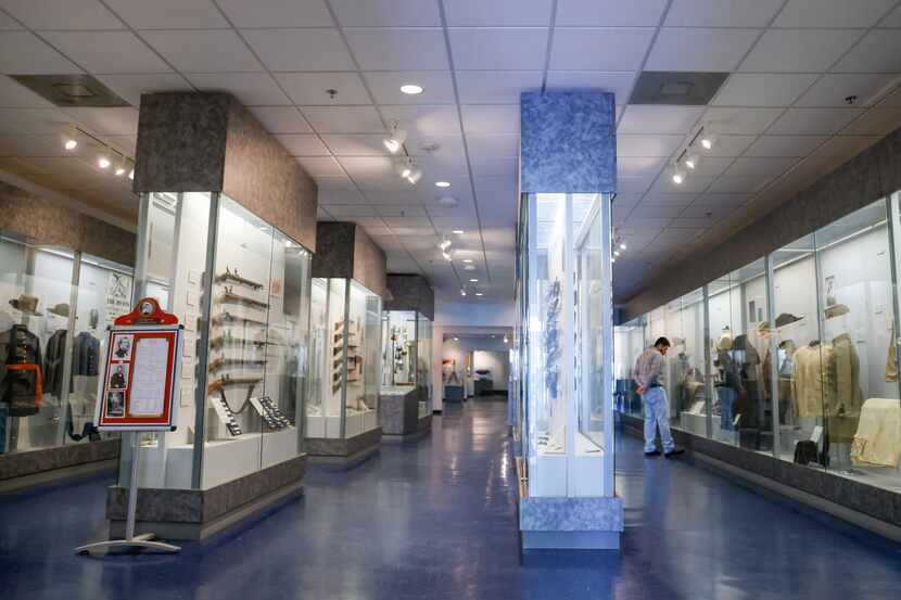 North Richland Hills resident David Cavada looks at artifacts lining the walls at the Texas...