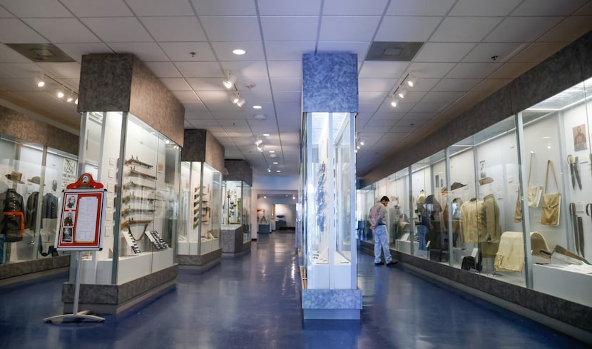 North Richland Hills resident David Cavada looks at artifacts lining the walls at the Texas...