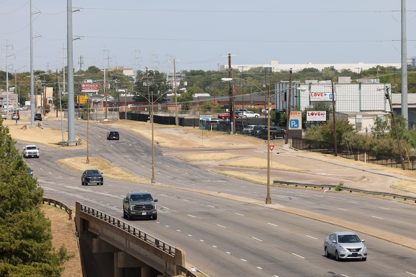 Traffic passes along Harry Hines Boulevard by the Southwestern Medical District on Tuesday....