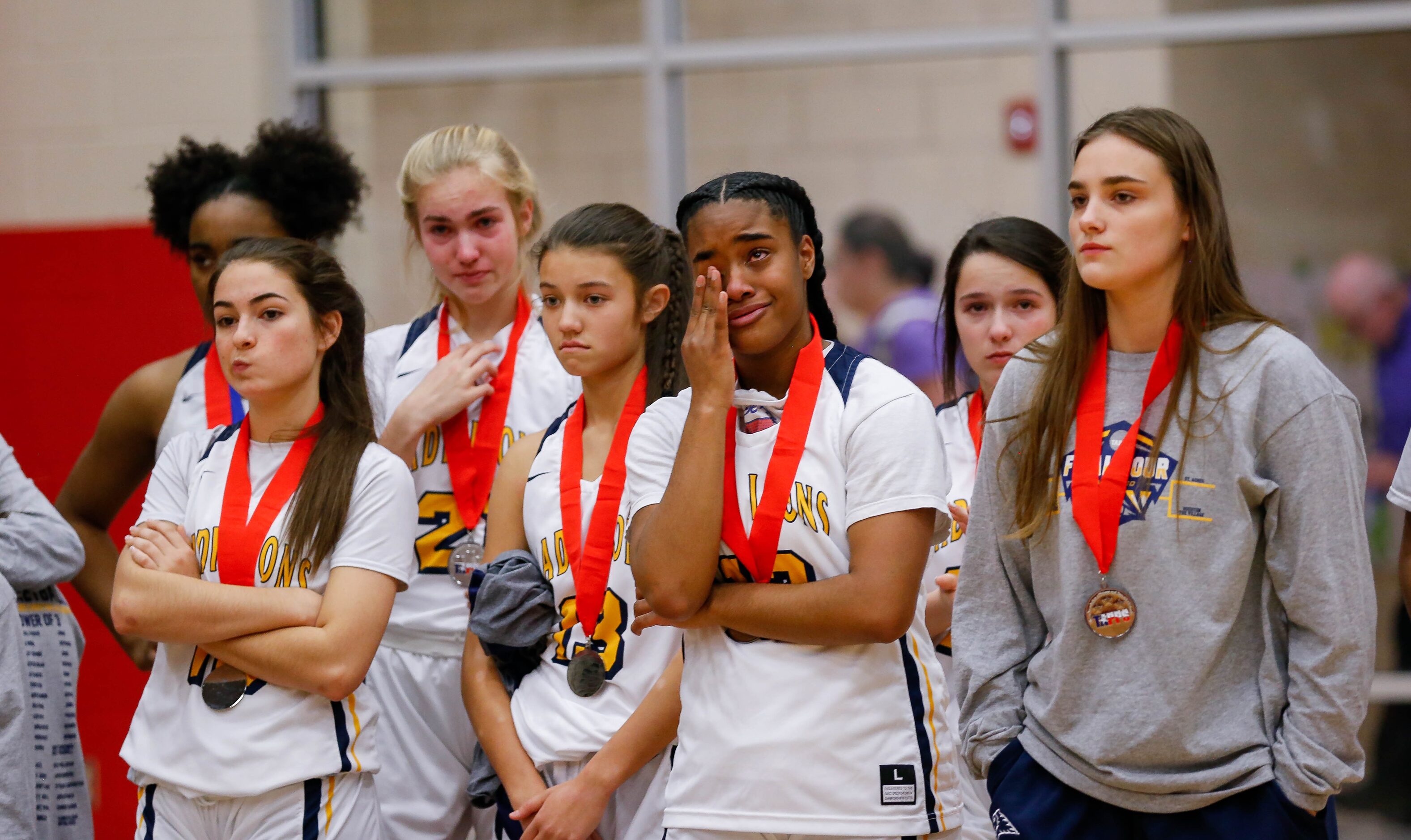 Plano Prestonwood Christian players react after losing a TAPPS Class 6A girls basketball...