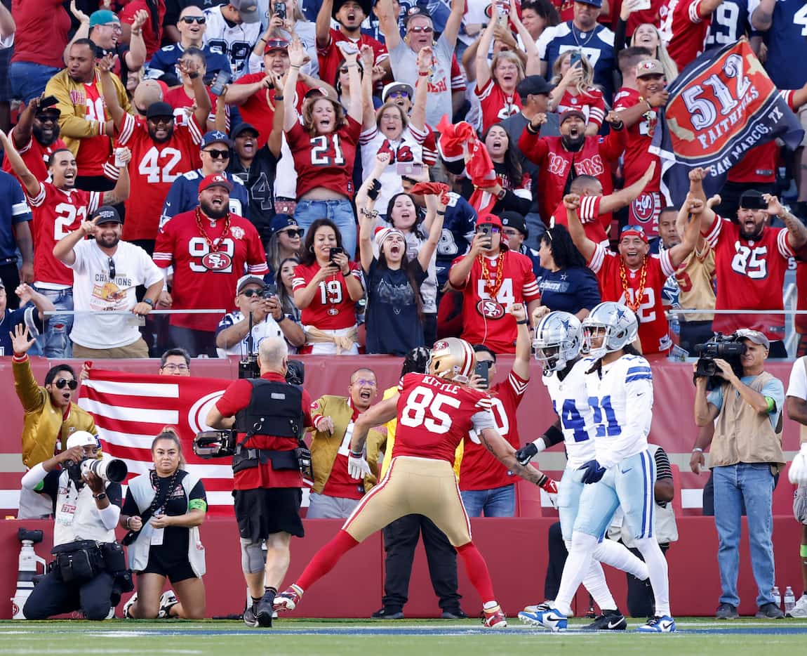San Francisco 49ers tight end George Kittle (85) spikes the ball in front of Dallas Cowboys...