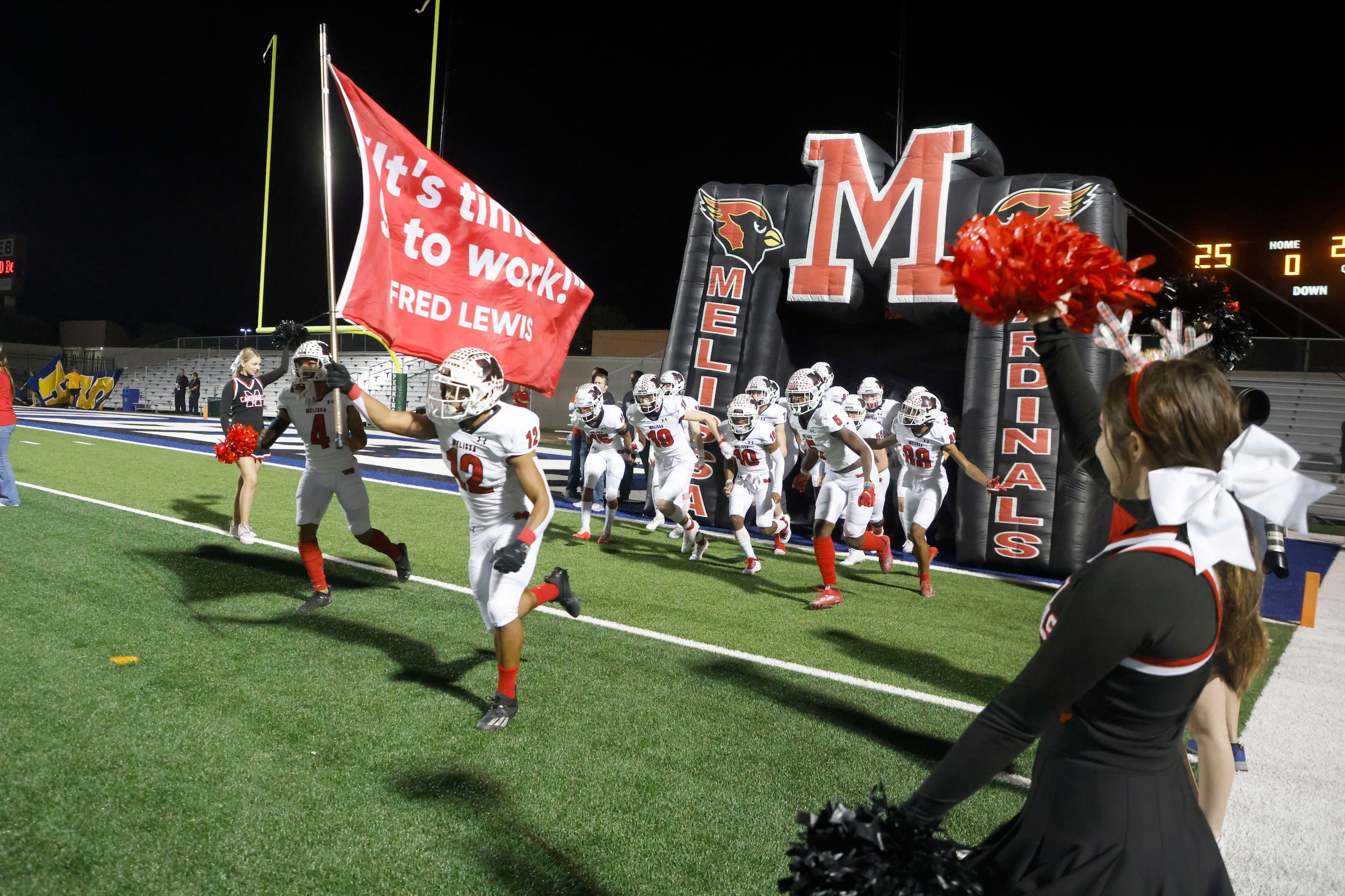 Melissa’s Ashton Mitchell-Johnson (12) leads the team onto the field as they played...