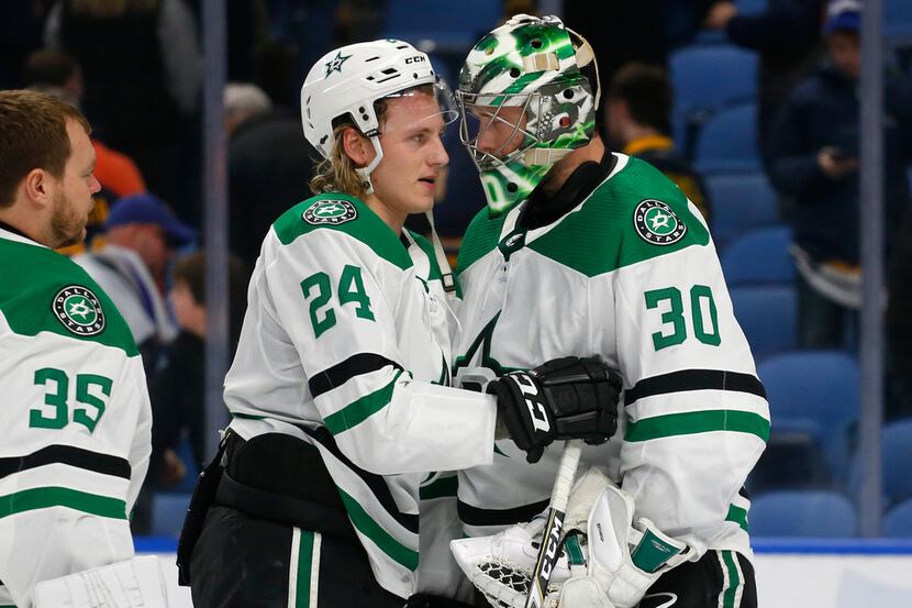 Dallas Stars forward Roope Hintz (24) and goalie Ben Bishop (30) celebrate the team's 2-0...