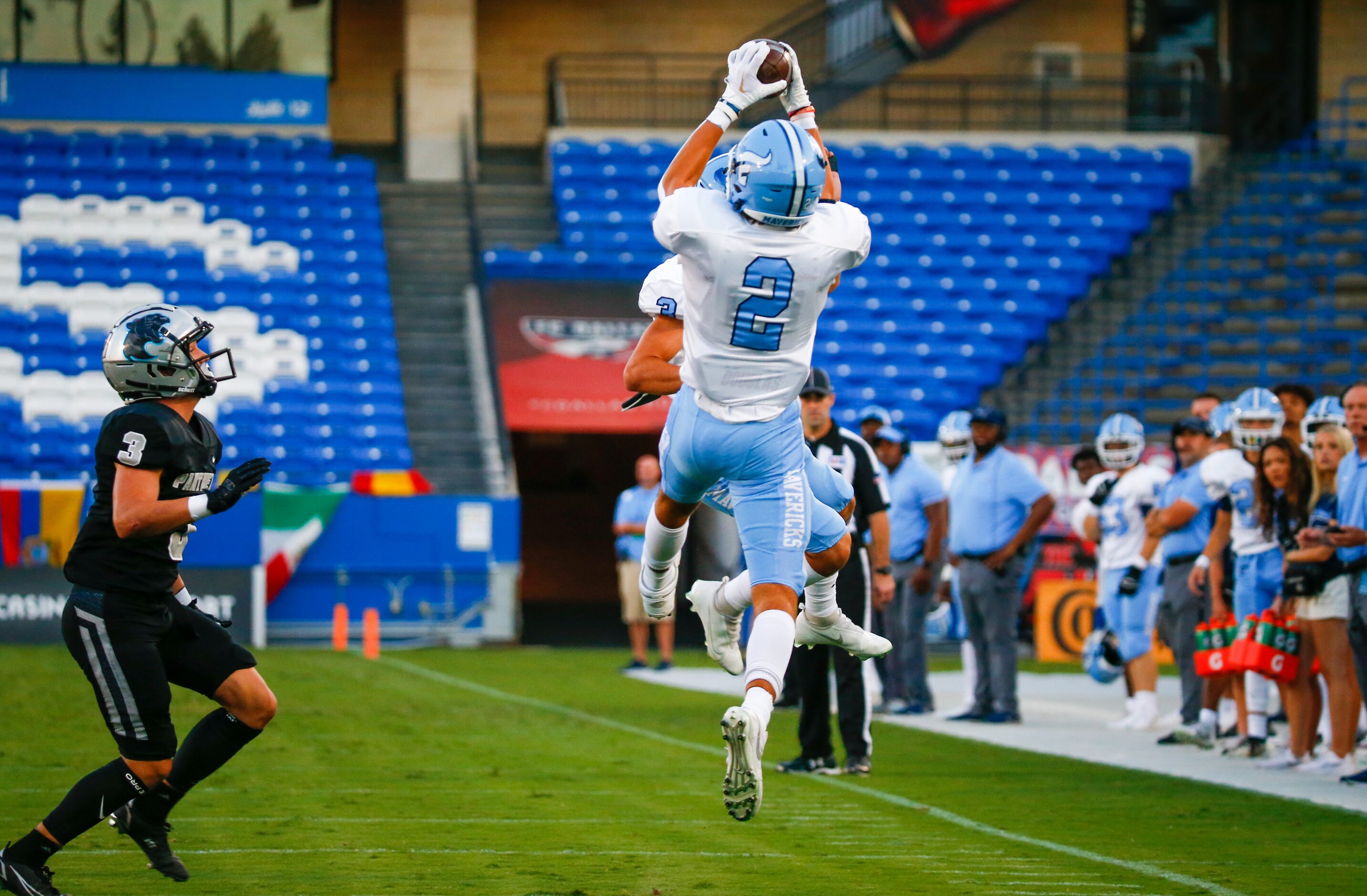 Emerson Mavericks wide receiver Kylen Evans (2) completes a pass before running into the end...