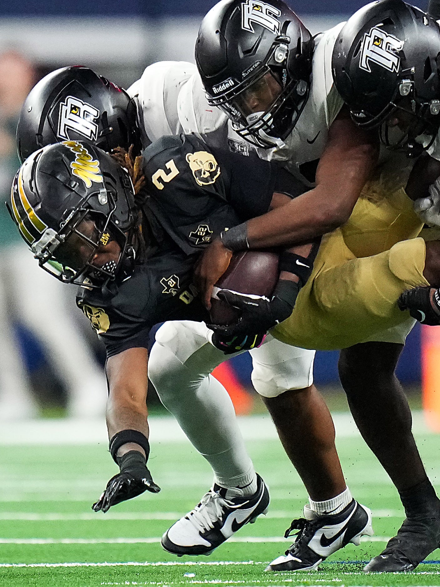 South Oak Cliff running back Mikail Trotter (2) is stopped by the Richmond Randle defense...