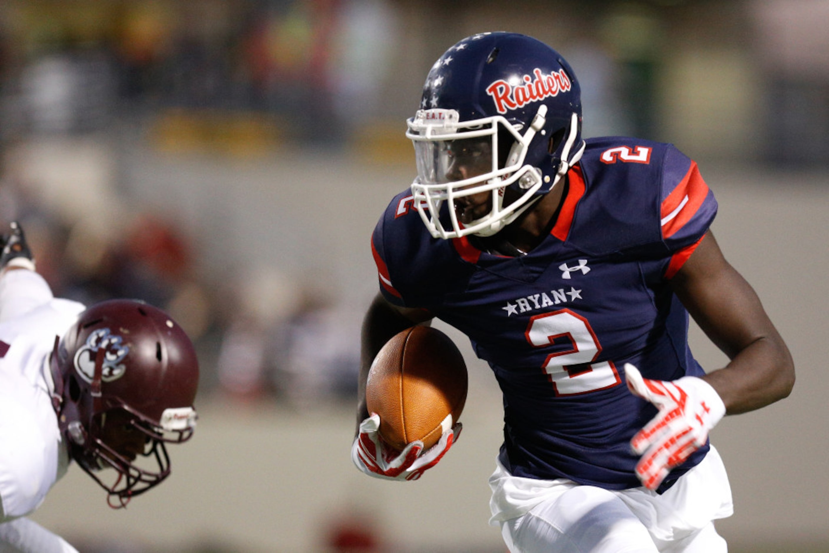 Ryan junior wide receiver Gabriel Douglas (2) runs after he makes a catch at C.H. Collins...