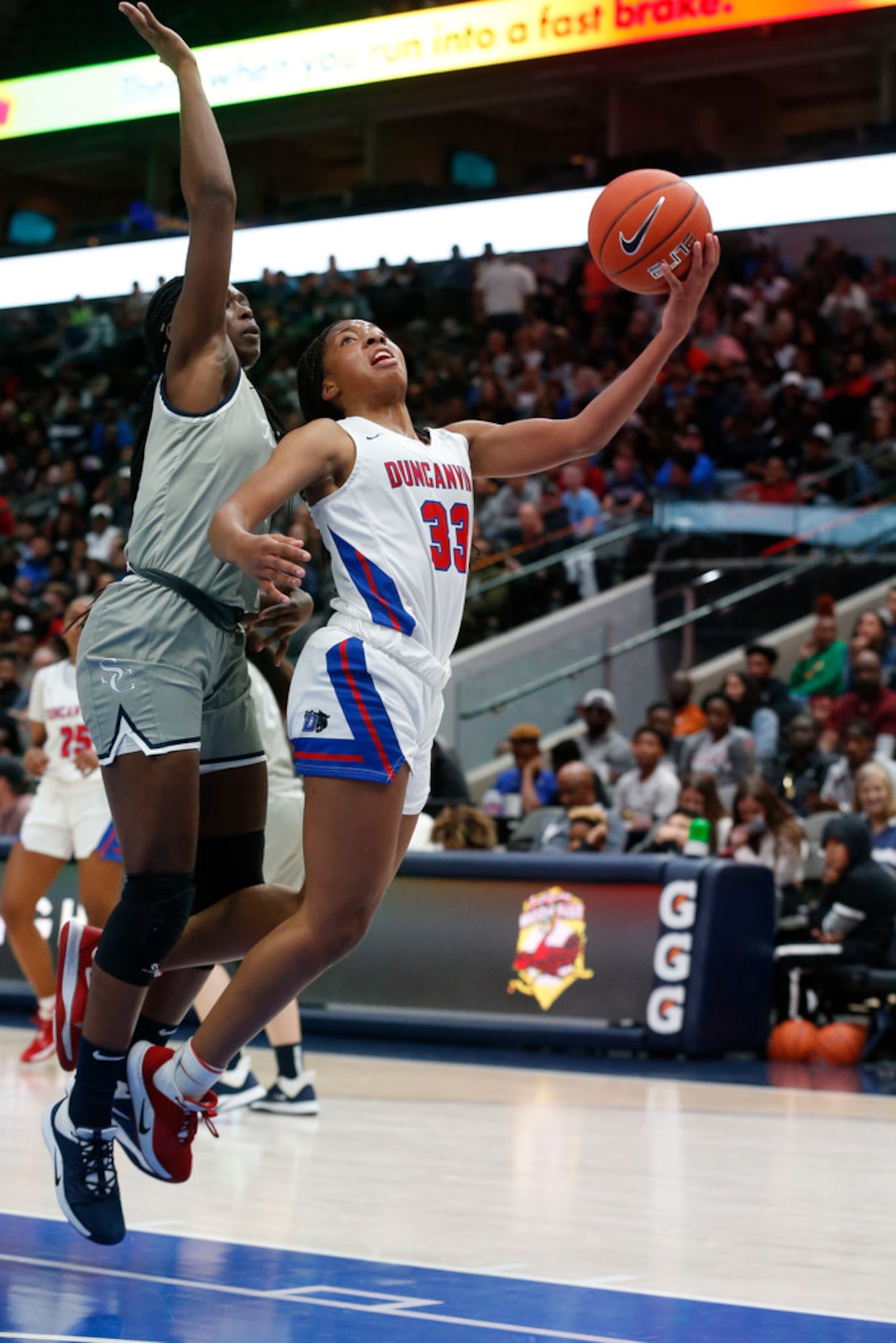 Duncanvilles's Nyah Wilson (33) is fouled by Sierra Canyon's Rosemary Odebunmi (4) during...