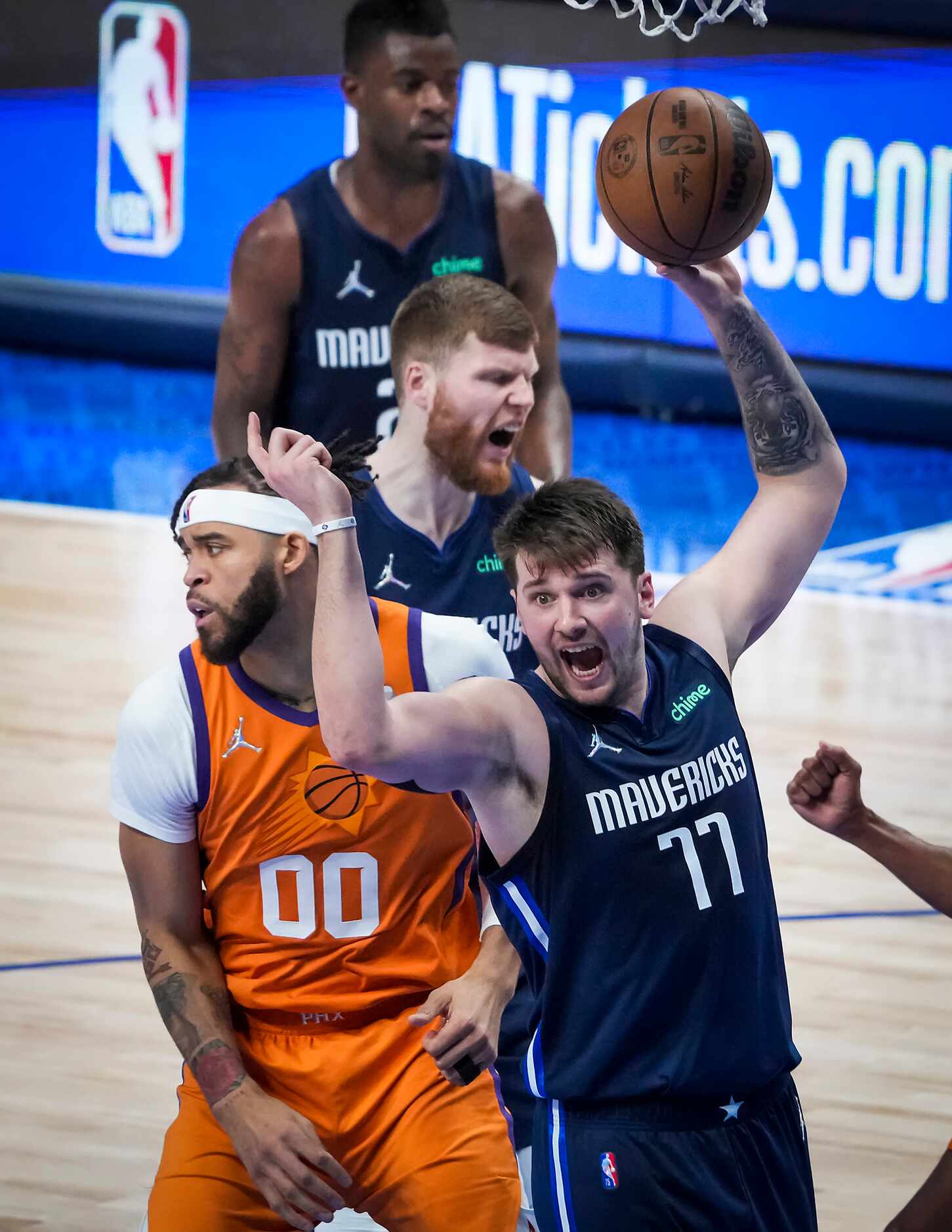 Dallas Mavericks guard Luka Doncic (77) reacts after a basket by Phoenix Suns center JaVale...