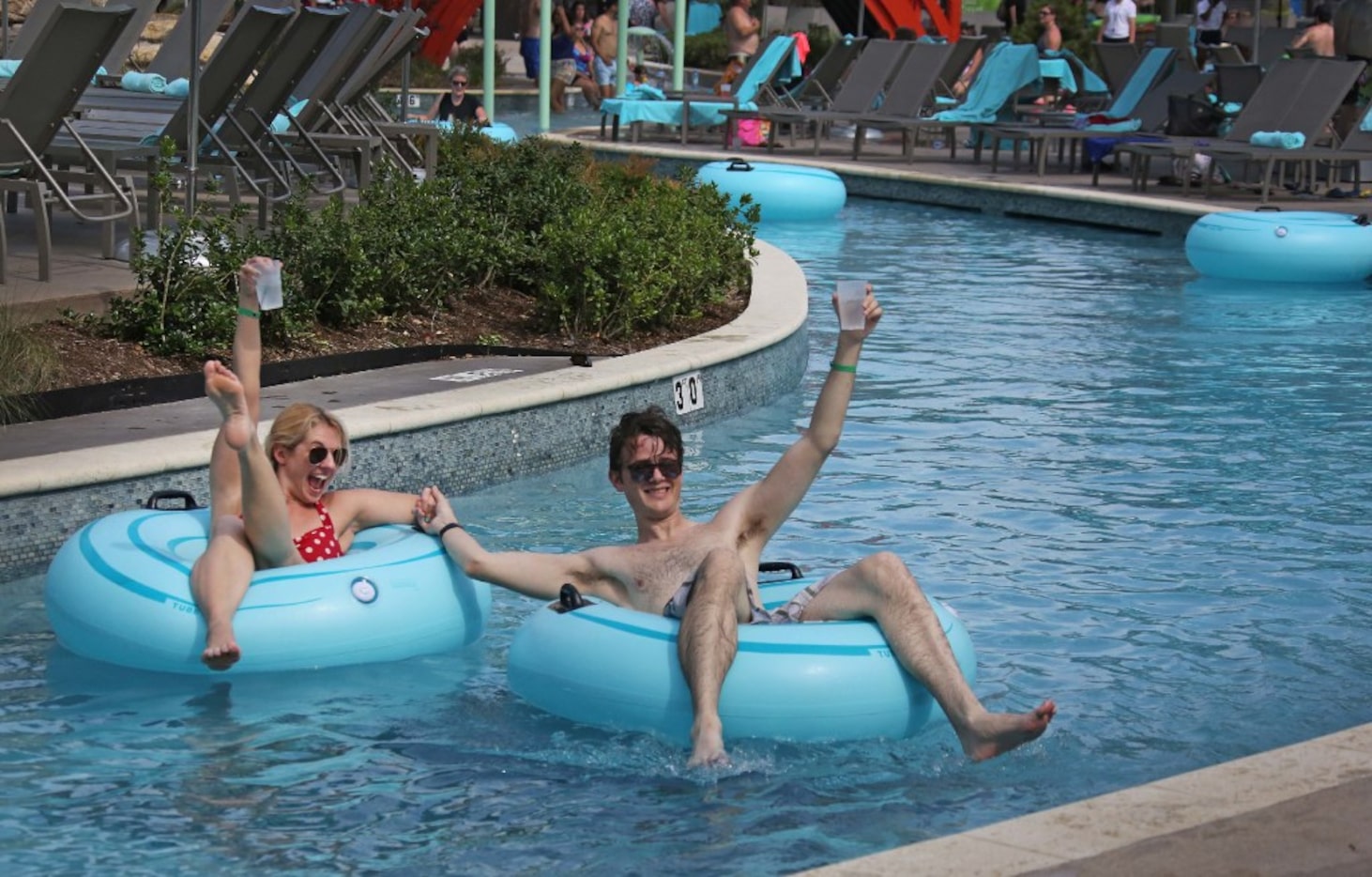 Swimmers enjoy a trip on the lazy river at JadeWaters
at the Hilton Anatole Hotel in Dallas,...