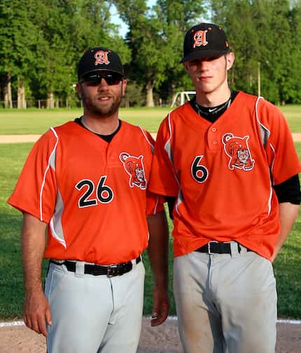 Texas Rangers catcher Jonah Heim, right, is pictured in his Amherst High School uniform with...