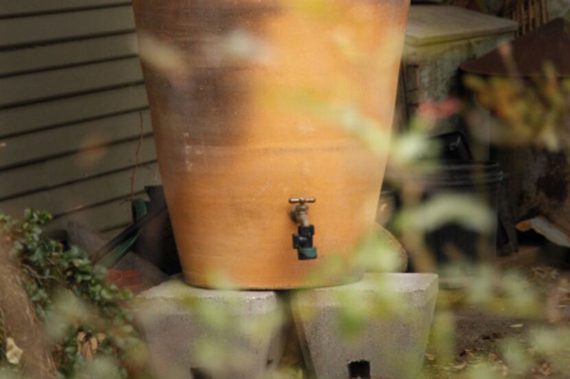 The terra-cotta rain barrel from Regalos de la Tierra in Oaxaca, Mexico at Mariana Greene's...