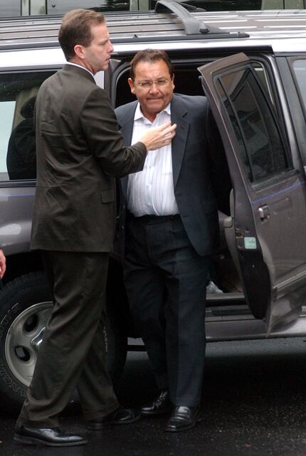 Jack Pytel is led out of a vehicle at the federal courthouse after being indicted on bribery...