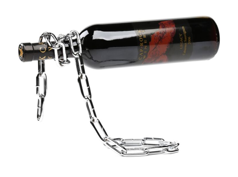 Defying gravity: Welded of chrome-plated iron, this chain link wine bottle holder gives the...
