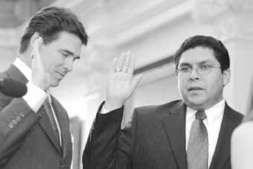 Texas Railroad Commissioner Victor Carrillo (right) was appointed by Gov. Rick Perry in...