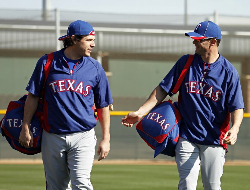 Texas Rangers designated hitter Michael Young (right) and infielder Ian Kinsler talk as they...