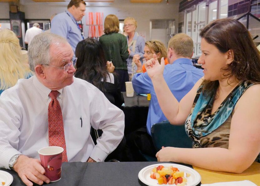 
Ed Leyden, left, President of Bishop Lynch High School, visits with Spanish teacher Ana...