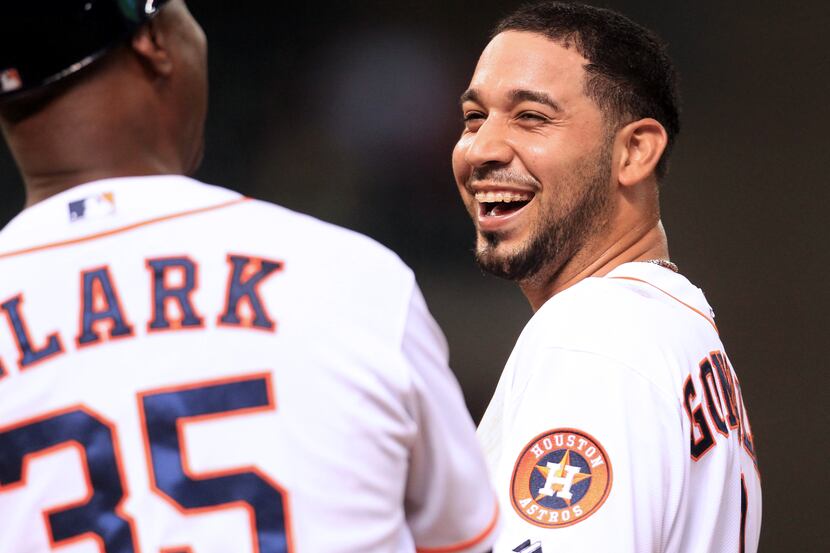Houston Astros shortstop Marwin Gonzalez (9) reacts on first base after breaking up a...