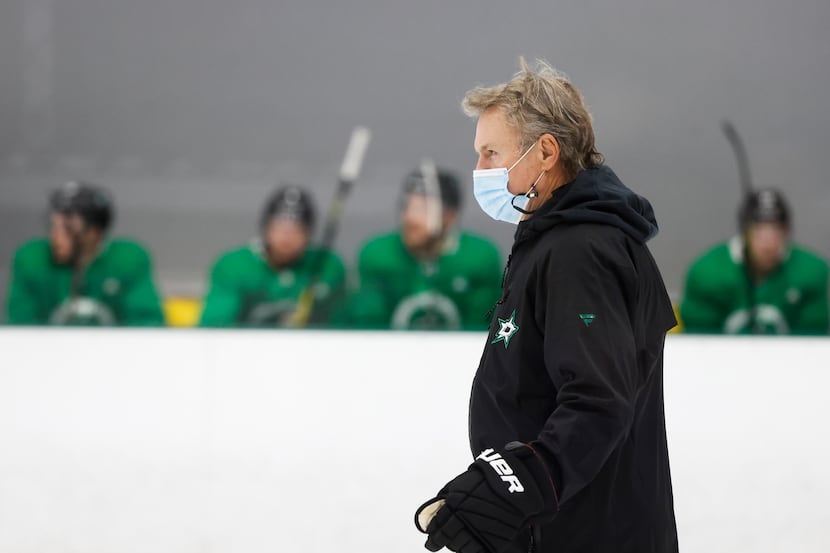 Dallas Stars head coach Rick Bowness watches his team workout during a training camp...