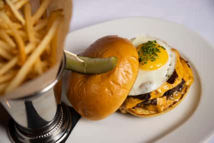 The NDA burger, $22, comes with bacon and an egg.