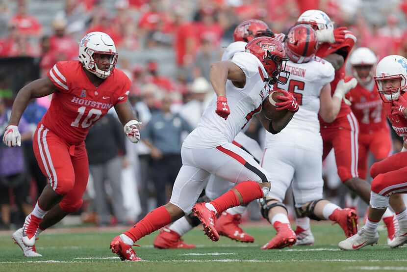 HOUSTON, TX - SEPTEMBER 23: Justin Stockton #4 of the Texas Tech Red Raiders rushes against...