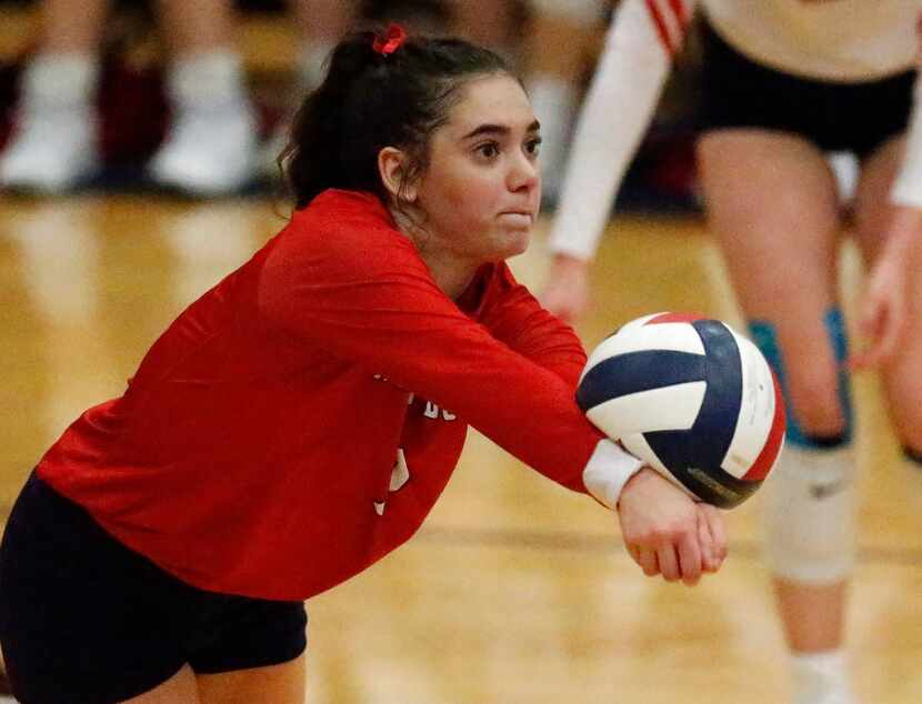 McKinney Boyd High School defensive specialist Macy Parker (7) receives a serve during game...