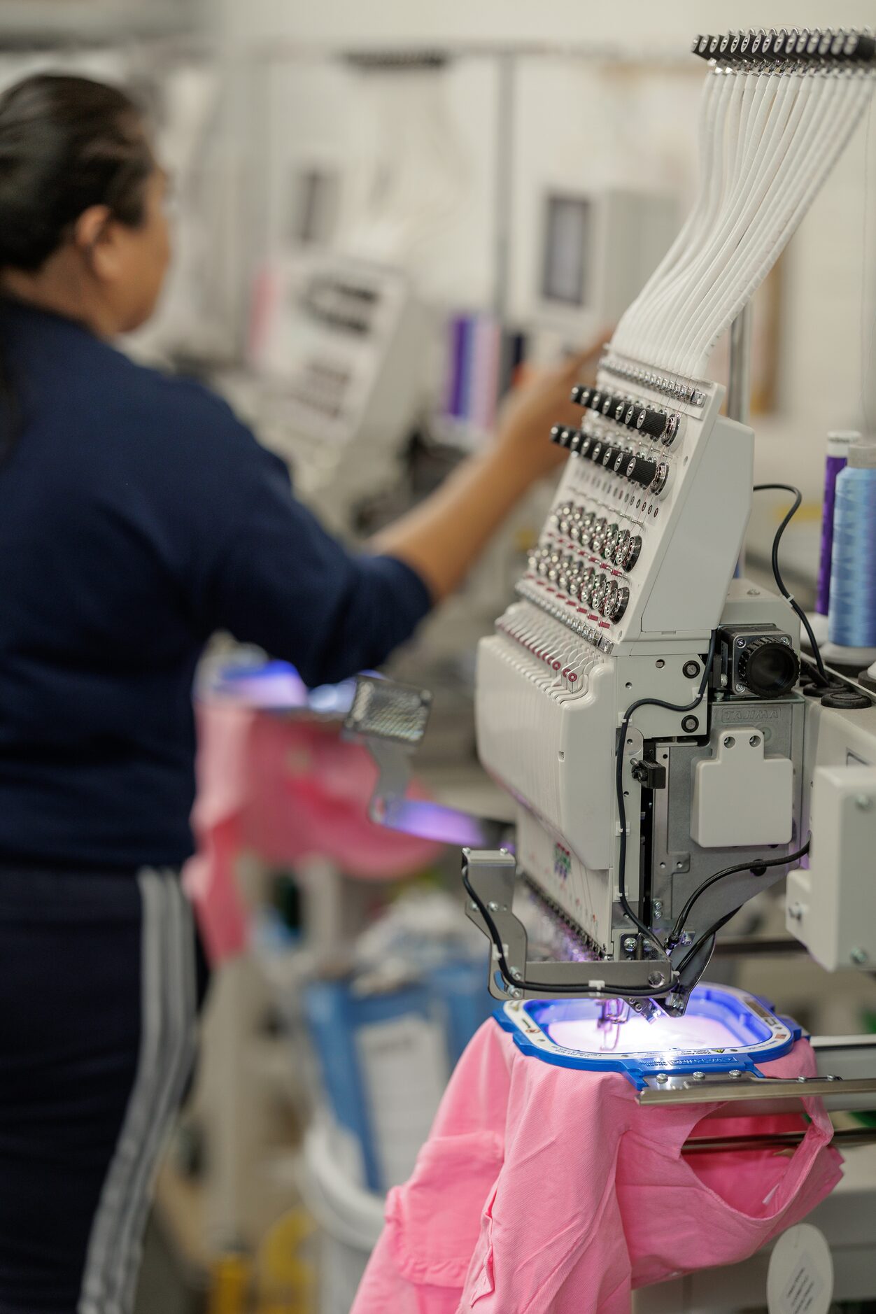 Gregoria Baltazar works on putting monograms on clothes at Classic Whimsy in Dallas, TX on...