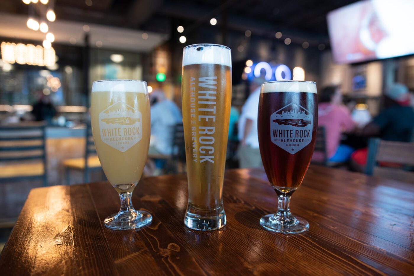 White Rock Alehouse makes eight of their beers on site.  From left is the IPO IPA, the Big...