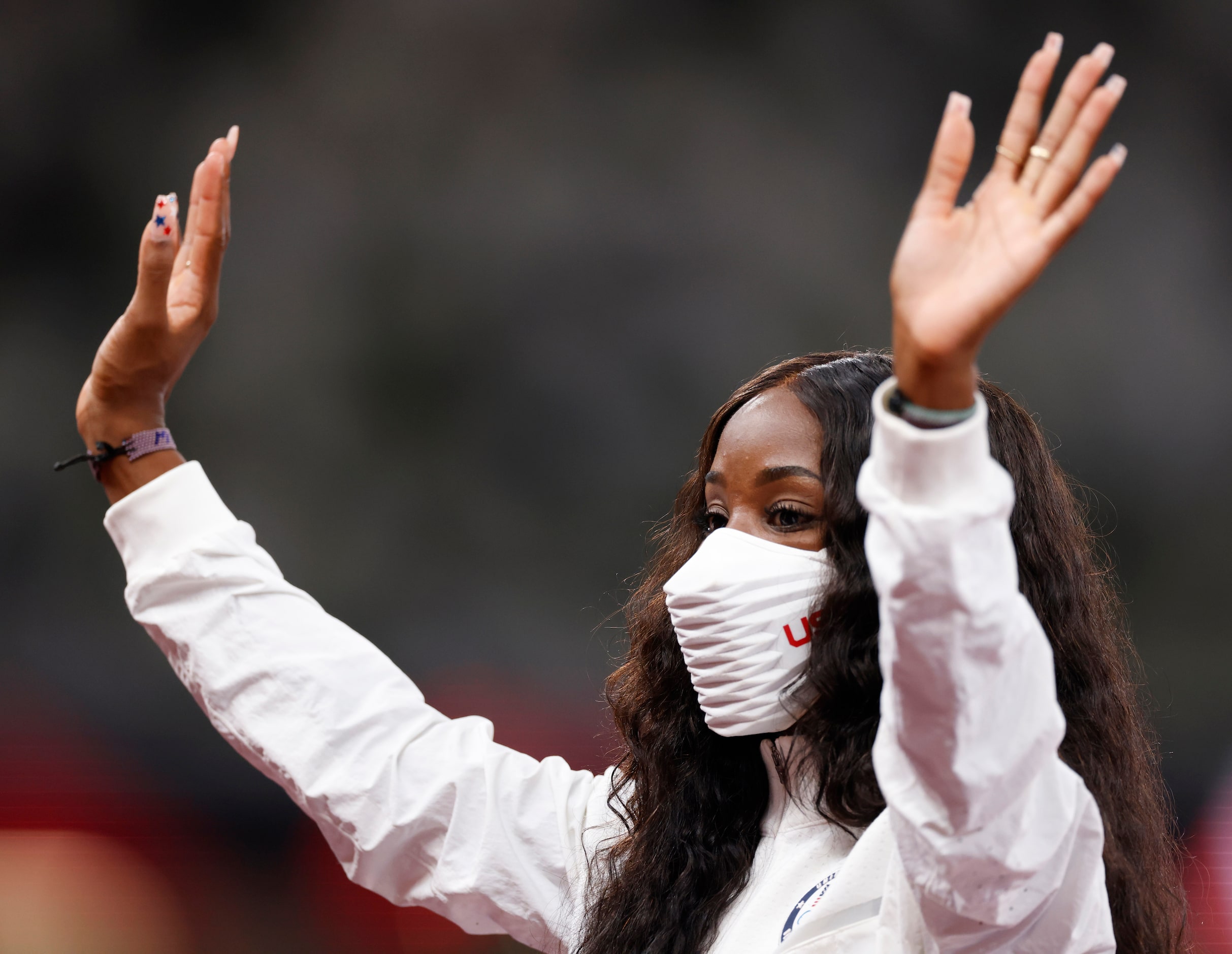 USA’s Kendra Harrison waves as she is introduced as the silver medal winner in the 100 meter...