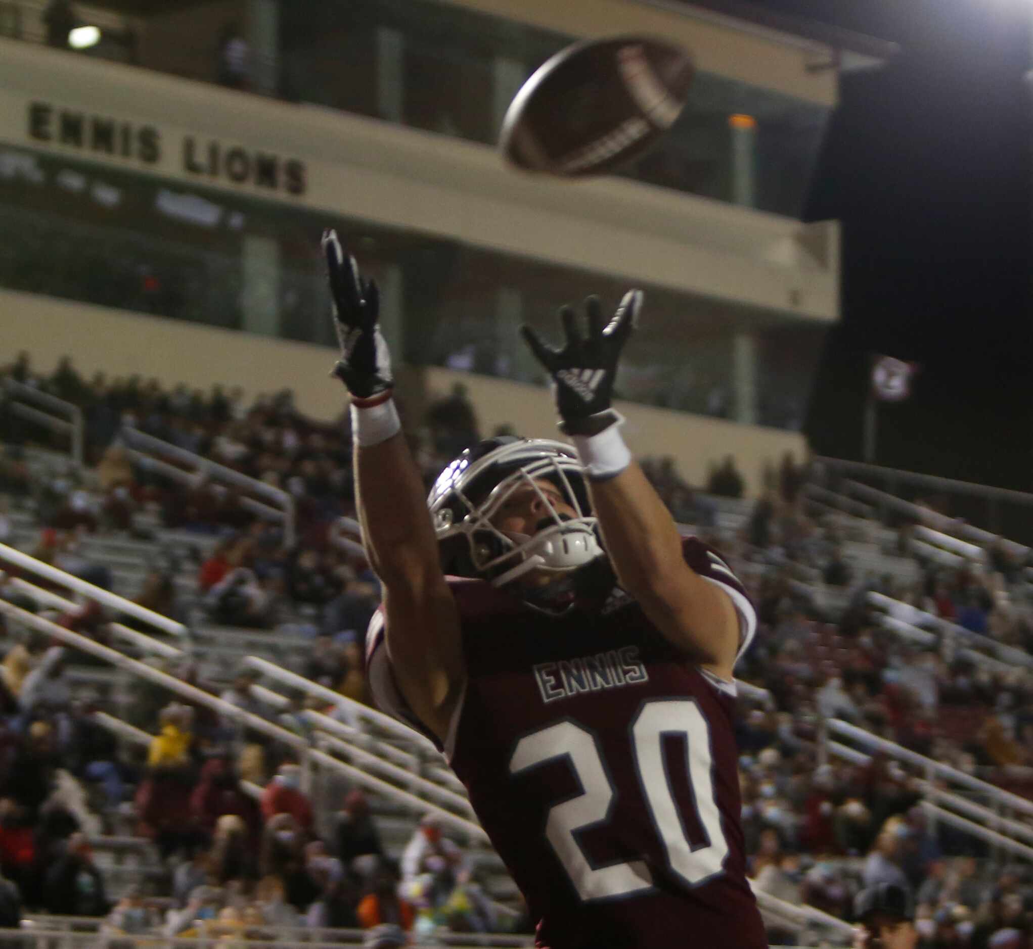 Ennis receiver Ashton Ehly (20) leaps to pull in a 19-yard receiving touchdown in front of...