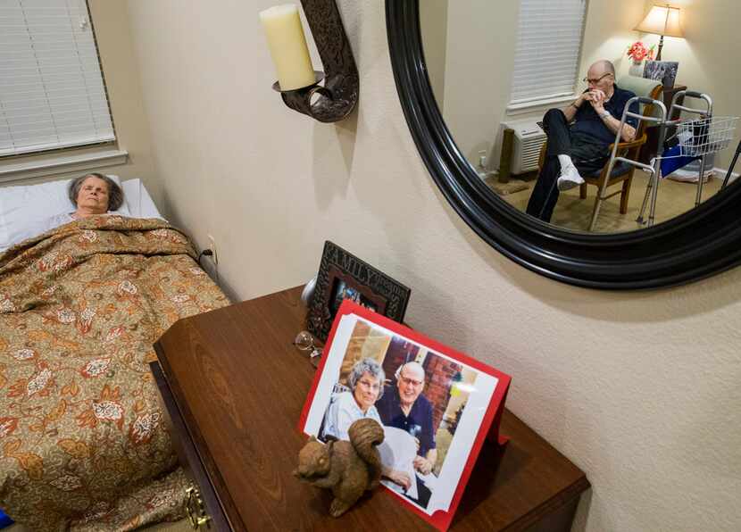 A recent photo is displayed on a dresser as Bob Stiegler sits with his wife, Norma, at...