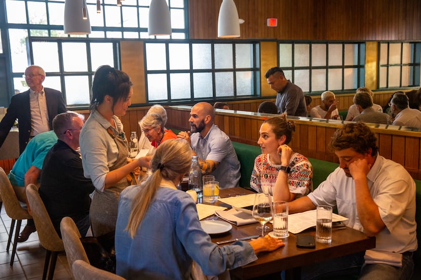 Patrons visit and eat at the Homewood restaurant in Dallas in 2019.