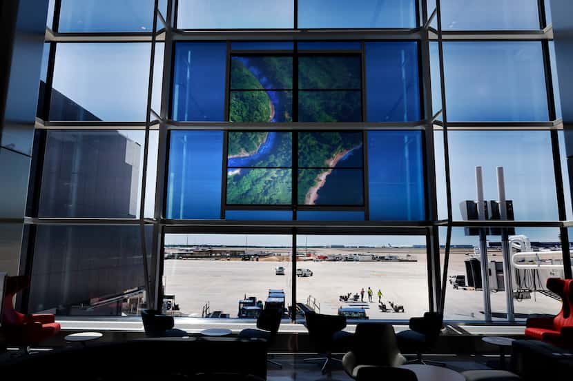 A translucent video image is displayed on the windows of the new Terminal D Extension at...